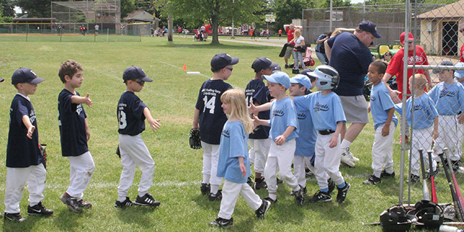 kids shaking hands after a baseball game