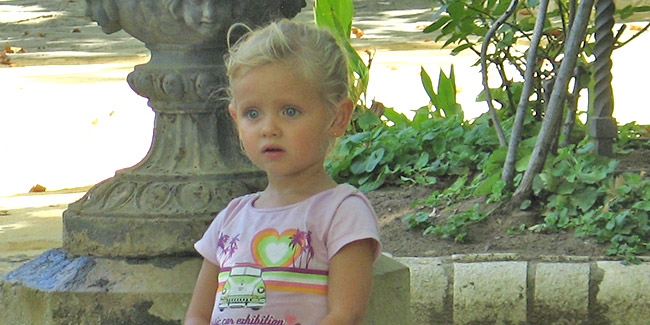 A young girl, looking nervous